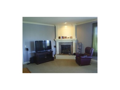 Livingroom is all open with fireplace.