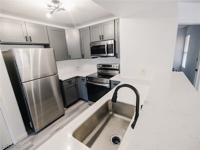 Kitchen featuring stainless steel appliances, gray