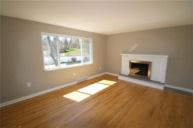 Large window in living room lets in lots of natura