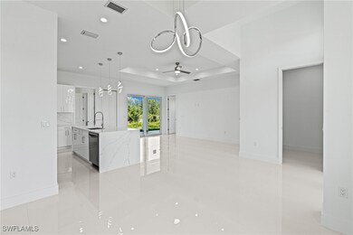 Unfurnished living room featuring a ceiling fan, l