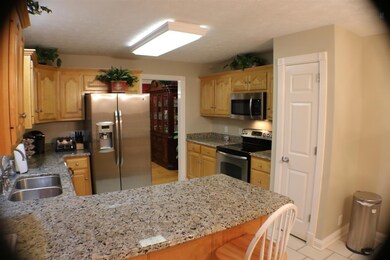 Kitchen with granite counter tops. 