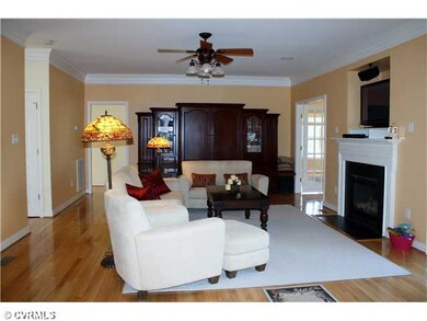 Den/Family/Great Room - This cozy, but spacious, family room is the center of the home.  There are built-in surround speakers, gas fireplace, a dry bar with wine chiller, and two sets of french doors -- one to the deck and one to the billiard room.