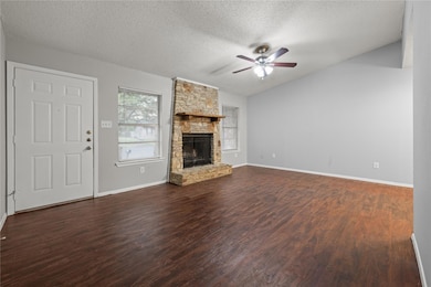 Unfurnished living room featuring dark wood finis