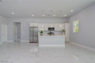 Kitchen with appliances with stainless steel finis
