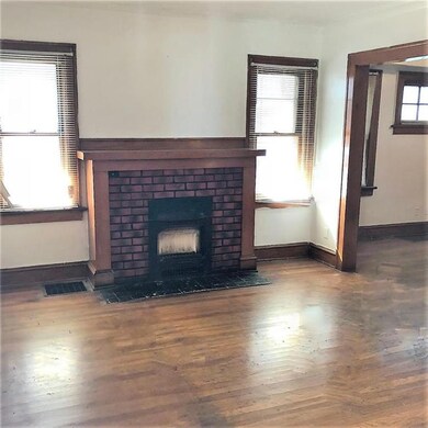 Formal living room with charming fireplace