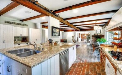 Huge kitchen island flows into family room with fi