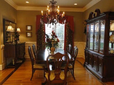 Accent strips of walnut outline the formal dining area.