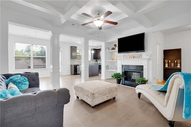 Living area featuring light wood-style flooring, o