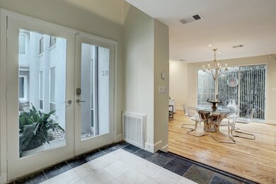 Inside the light filled entryway and shows the gle