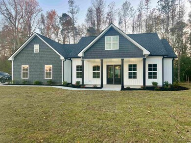 View of front of property featuring covered porch 