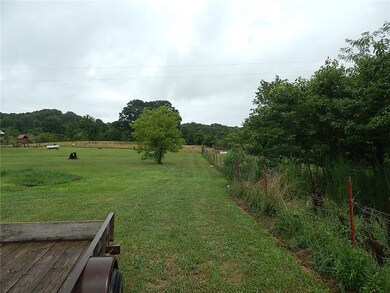 Park at end of road in the corner of the yard Wire