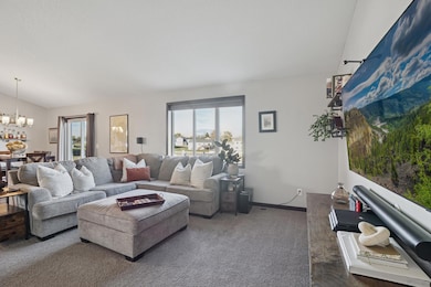 Large windows provide abundant natural light throughout the main level