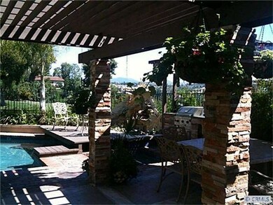 Backyard stone columns and waterfall.