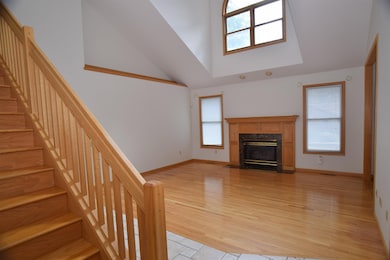 The main floor living room is completed with hardwood flooring and features a unique tall ceiling with a display area.  You will have plenty of natural light coming in from the many windows.