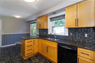 Eat-In Kitchen with granite counters and modern ba