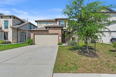 View of front of property with concrete driveway,
