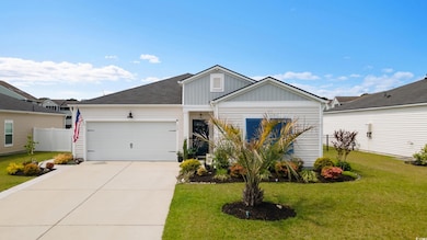 View of front facade featuring an attached garage,