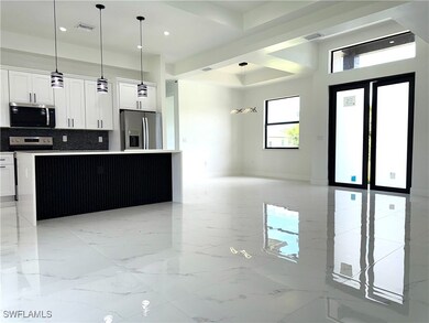Kitchen with appliances with stainless steel finis