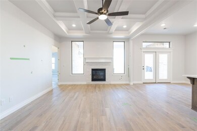 Kitchen with visible vents, a sink, light wood fin
