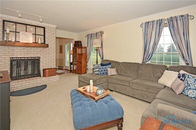 Living Room features wood burning fireplace.