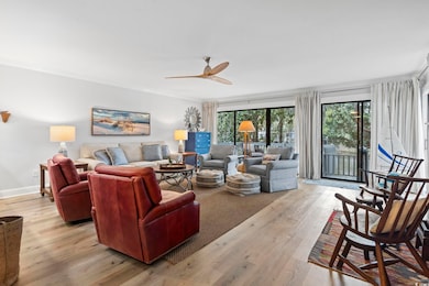 Living area with baseboards, ornamental molding, l