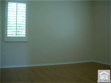 3rd bed with wood flooring.