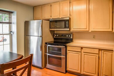 The kitchen has stainless steel appliances.