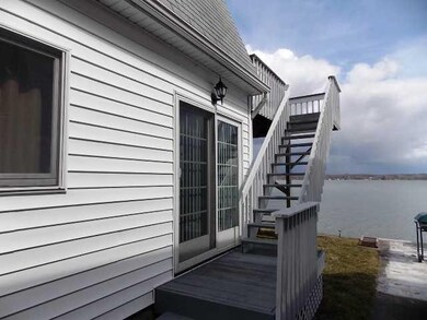 View. Side of home and stairway to deck area.