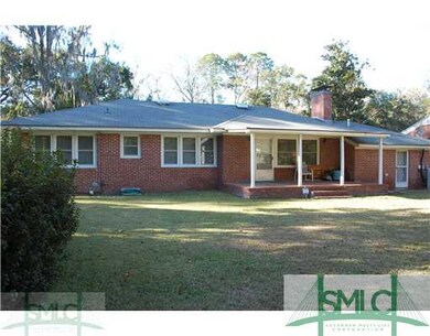 Exterior Back. Huge back yard fenced  in open bric