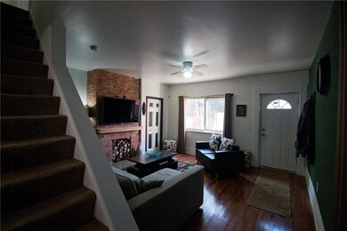 Decorative fireplace with exposed brick make this 
