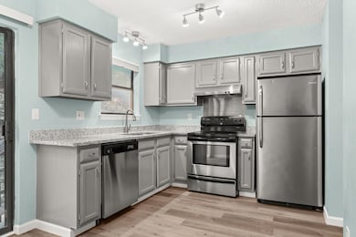 Kitchen featuring appliances with stainless steel