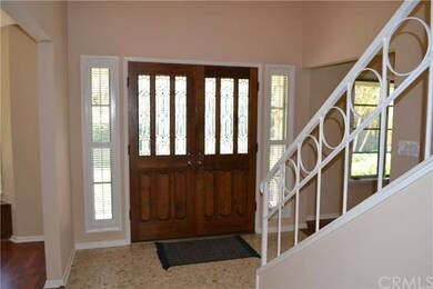 Elegant Double Door Entry Opens to the Living Room