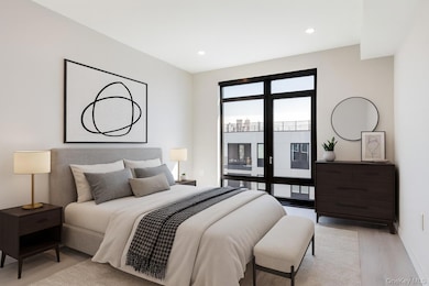 Bedroom with light wood finished floors, access to outside, and recessed lighting