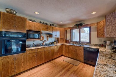Gourmet kitchen with granite countertops, high end