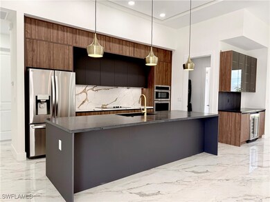 Kitchen with appliances with stainless steel finis