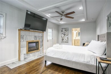 Bedroom featuring ensuite bath, recessed lighting,