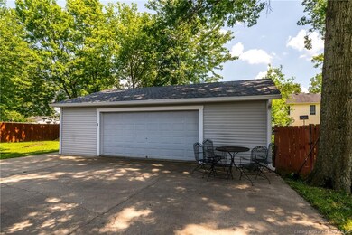 Huge detached garaged with extra concrete pad.
