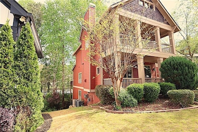 View of left side of home, featuring covered porch