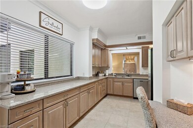 Kitchen with light tile patterned floors, visible 