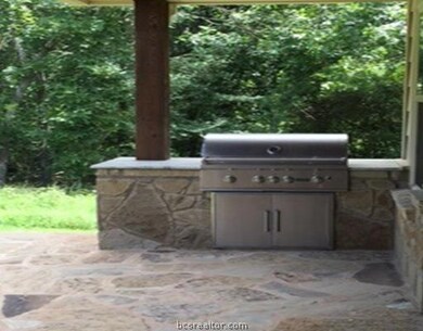 Other. Outdoor patio with flagstone and grill