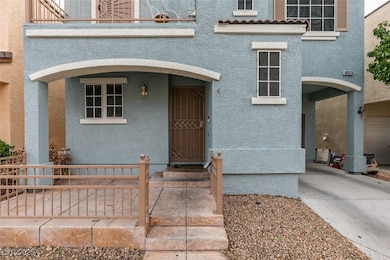View of exterior entry with stucco siding and a ba