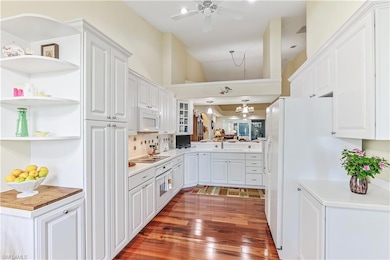 Kitchen opens to living area. So much storage with pull out drawers