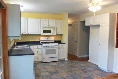 Newer, updated kitchen features tile floor, gas co