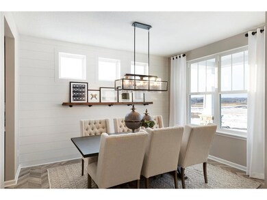 The spacious dining room, as shown in our former Continental model in Woodbury.