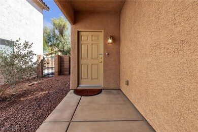 Entrance to property featuring stucco siding and a