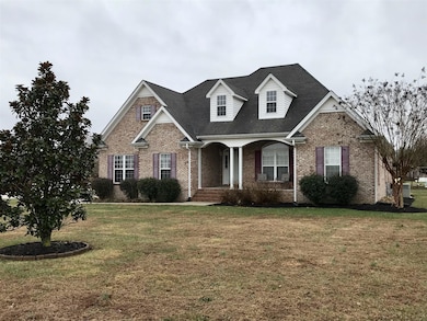 Spacious front yard with beautiful Magnolia tree!
