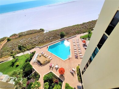 Community pool with a patio