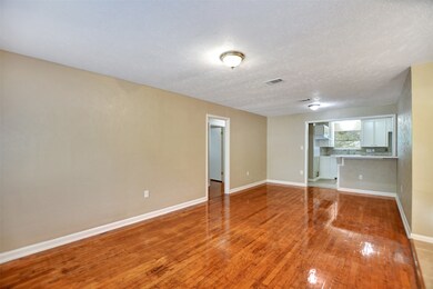 Beautiful refinished floors welcome you into the family dining area