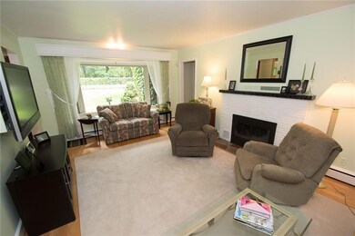 Living Room With Hardwood Floors And Gas Fireplace