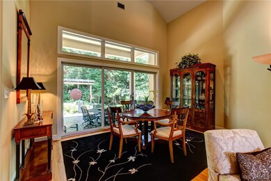 Sitting or eating are overlooking the backyard and